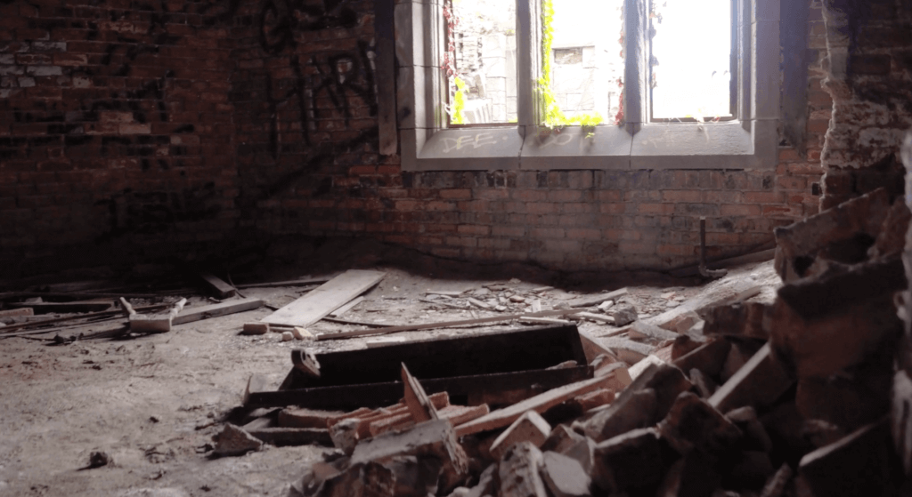 Light streaming through windows in a ruined building