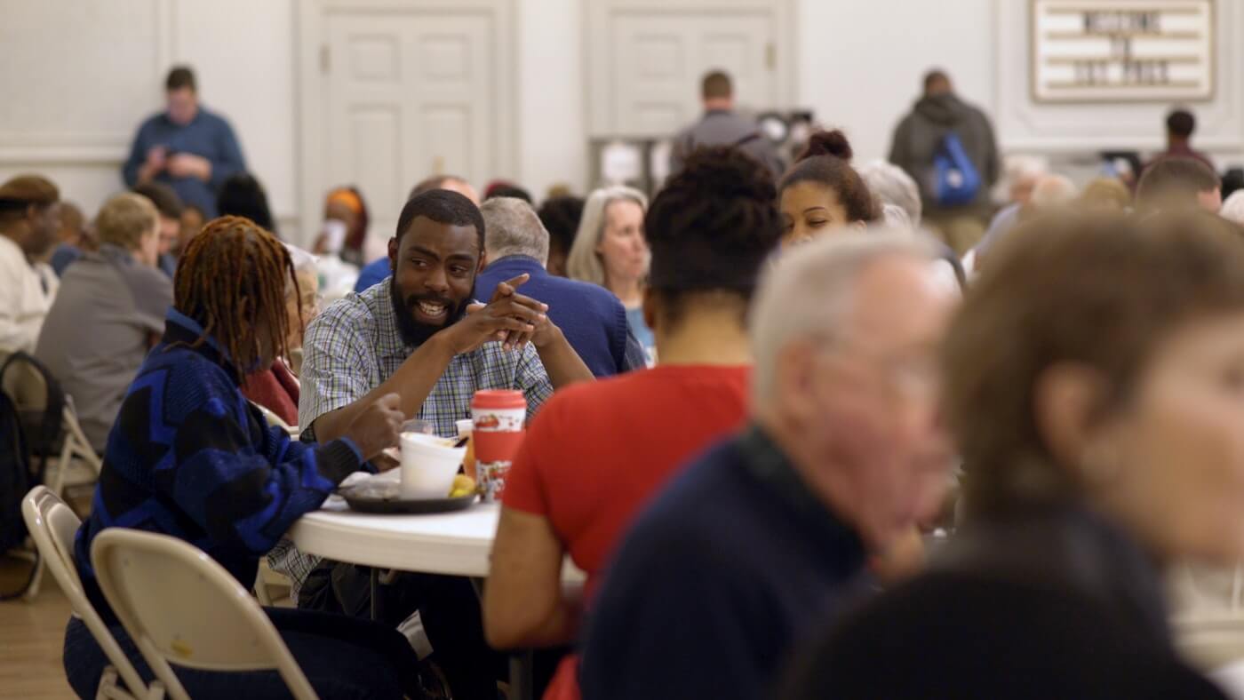 A crowd of people eating together